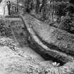 Digital copy of excavation photograph: view of ditch possibly near St Leonards.