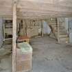 Interior. Ground floor. Main milling area (W part of structure). View from S showing fanner chaff storage cupboard, seive and stairs to first floor.