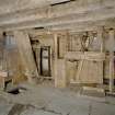 Interior. Ground floor. Main  milling area (W part of structure). N end of room. Detail showing fanner, bucket elevator, gear cupboard with sieve in front.