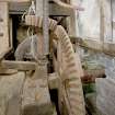 Interior. Ground floor. Main  milling area (W part of structure). Gear cupboard showing bevel pit wheel wallower and great spr wheel and stone nut of the grinding stones on the first floor..