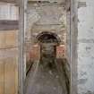 Interior. Ground floor. Kiln room entrance and firebox. Detail.