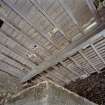 Interior. Ground floor. Kiln room. Kiln floor. Detail showing inserted strengthening steel beam