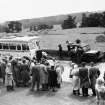 Scottish Summer School in Archaeology for 1953 on a visit to the excavations at the Roman camp at Carronbridge by Mr John Clarke. The RCAHMS Jeep HYT 200 is fitted with loud speakers.