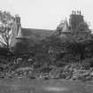 General view of Croft an Righ House from South, showing part of garden