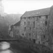View from Water of Leith Bridge of Lindsay's Mill and also Holy Trinity Church and part of Dean Bridge in the distance