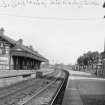 Kilwinning East Station: platform view entitled 'L.M.S. (Caledonian) Kilwinning East'.