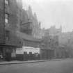 General view of no. 123-149 Pleasance, Edinburgh, seen from the South South East showing the premises of G Cuthbert butcher (no.149), F D Peruzze Ices and Confections (no.145) and a cycle and prams repair shop (no.143)