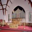 Interior. Platform. View from WSW showing organ, pupit, communion table and lecturn