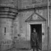 View of man in doorway of Pitreavie Castle.
Annotation on print: 'William Beveridge?'.