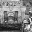 View of drawing room and marble fireplace with ornaments and possible bearskin rug, Montrave House.