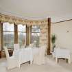 Interior. View of dining room into bay window