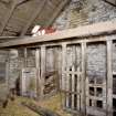 Interior. View of  byre showing timber stalls