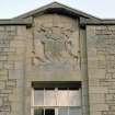 Detail of armorial panel above main entrance on W facade