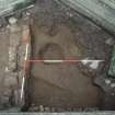 Excavation photographs: Trench 1, showing charnel pit and wall F005. From S at Elgin, Cathedral.