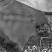 Brunstane, oblique aerial view, taken from the WNW, centred on cropmarks including coal pits. A rectilinear enclosure beside Brunstane House is visible in the centre right of the photograph.