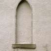 Detail of blocked arched window at ground floor level