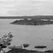 General view of island dun showing remnants of causeway.