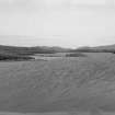 General view across loch to dun.