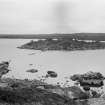 General view towards dun showing remnants of causeway.