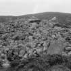 View across the cairn from the south east looking towards the entrance.