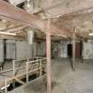 Interior view of grain store, Kerse Road, Stirling, showing second floor, W end from SW. Note mouth of hopper above the stairwell.