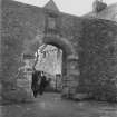 Glasgow, Auchinlea Road, Provan Hall.
View of entrance with two gentlemen emerging from courtyard.