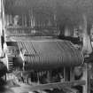 View of Leverburgh woman at her loom.
