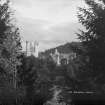 Balmoral Castle.
General view South obscured by trees.
Insc: '504 Balmoral Castle'