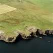 Oblique aerial photograph showing the chambered cairn, Isbister, South Ronaldsay