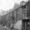 View of children playing outside Stockbridge houses.