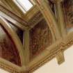 Stair hall, flower painted wall panels and supports under skylight, detail