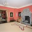 Interior. Ground floor.  View of N end of long hall showing fireplace and seating