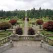 View of formal garden from lower level of stone staircase to North.
