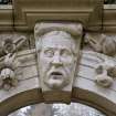 Archway (no.9 on plan) at West end of terrace, detail of carved head.