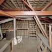 Interior. Attic view of roof structure and mail hall coved ceiling structure