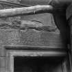 Detail of carved lintel above entrance doorway