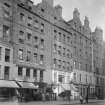 General view of Nos 341-374 High Street, Edinburgh showing the Hallelujah Army Hall, an ice and confectionary shop, the Edinburgh & Leith Equitable Sale Rooms (no.361), Tartaglia's Tea Rooms & Venetian Ice Cream Saloon (no.351) and A W Rennie spirit merchant (no.343).