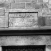 View of sculptured stone above the front door.
Inscription reads:	JEHOVA
	          NISI DOMINUS,
	          FRUSTRA 1614
	