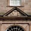 Courtyard, detail of pediment above arched window on north wall