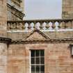 Courtyard, detail of pediment above window