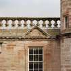 Courtyard, detail of pediment above window