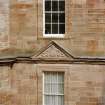 Courtyard, detail of pediment above window