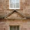 Courtyard, detail of pediment above window