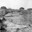 Drain through rampart with carers in position
From Photograph Album detailing excavations at Mumrills Fort