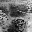 Boulder filled pit (partially emptied), one of two on either side of entrance
From Photograph Album detailing excavations at Mumrills Fort