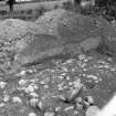 Roadway crossing foundation of Agricolan? rampart showing drain
From Photograph Album detailing excavations at Mumrills Fort
