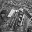Oblique aerial view. Here we see the three cooling towers  and the larger of the two gas holders, together with the engineering services building on the left and the power station bottom of the frame..