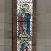 Interior. 
Chancel, detail of stained glass window (Charity) on N wall.