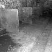 Interior.
Cow byre, view of stalls and flagstones.