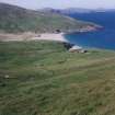 General view of schoolhouse and yard, with Mingulay Bay beyond.